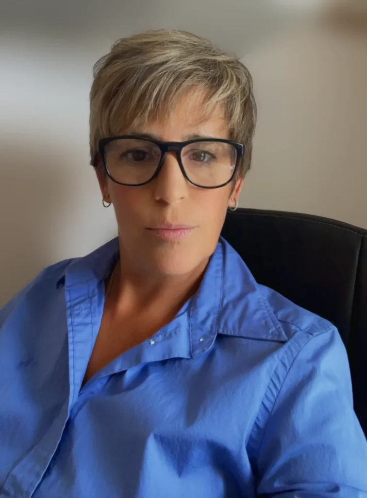 BABCP-accredited CBT therapist NHS trained. Tash at her desk in Dorset and Online, looking professional and approachable.